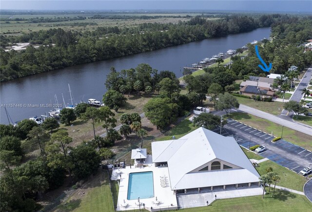 8904 SW Fishermans Wharf Dr, Stuart, FL 34997 - drone / aerial view of a large body of water, a forest, and a pool