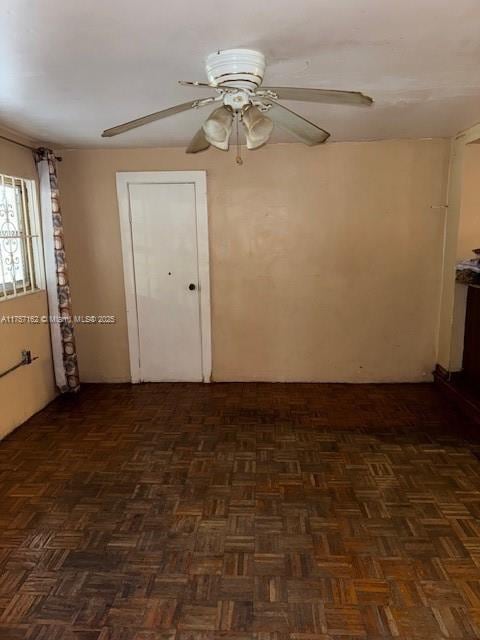 unfurnished room featuring a ceiling fan