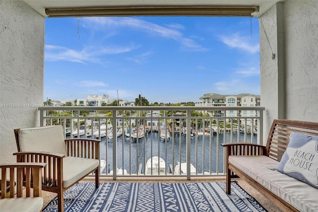 balcony featuring a water view