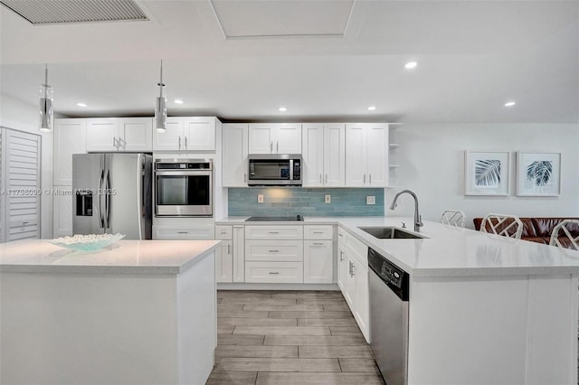 kitchen featuring tasteful backsplash, visible vents, appliances with stainless steel finishes, open shelves, and a sink