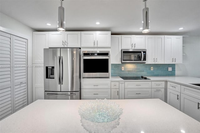 kitchen with decorative backsplash, decorative light fixtures, stainless steel appliances, white cabinetry, and open shelves