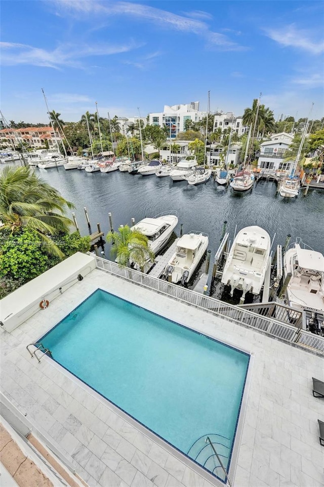 view of pool featuring a water view