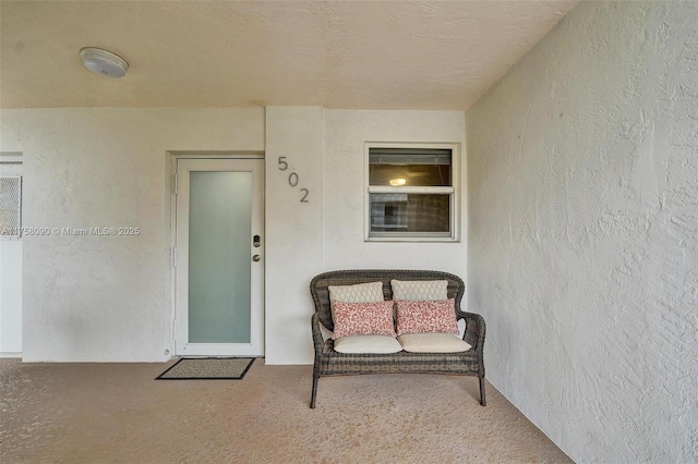 property entrance featuring stucco siding