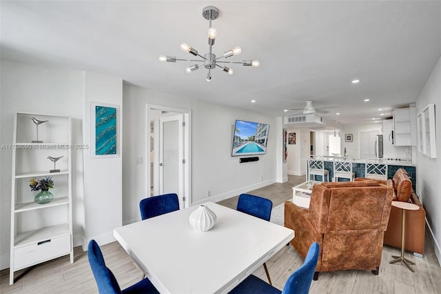 dining area with recessed lighting, baseboards, and light wood finished floors