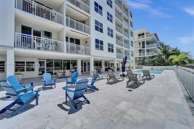 view of community with a patio and a pool