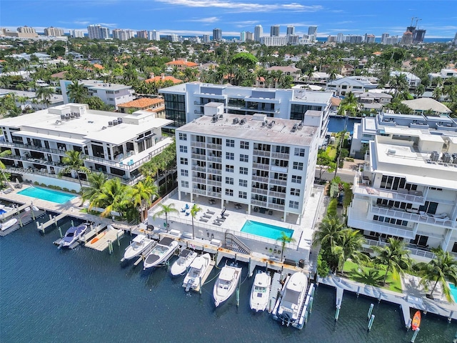 birds eye view of property featuring a water view and a view of city