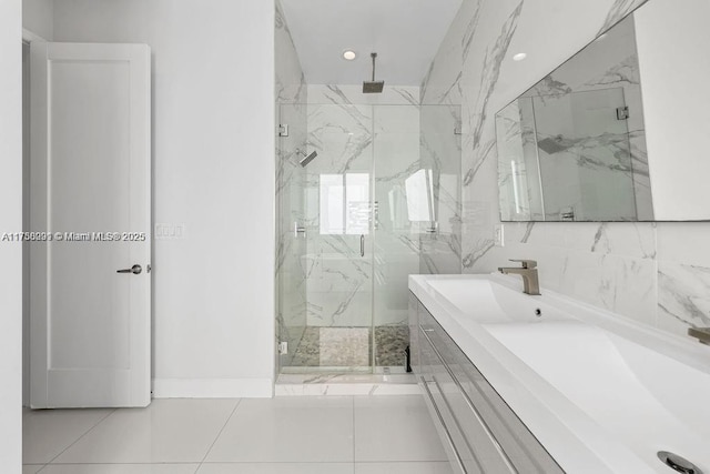 full bath with recessed lighting, a marble finish shower, and vanity