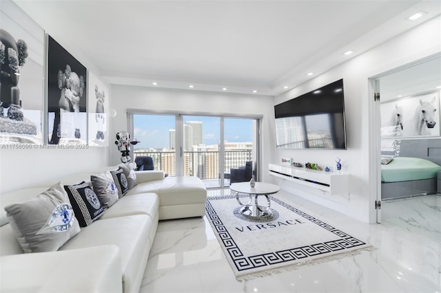 living area featuring marble finish floor and recessed lighting