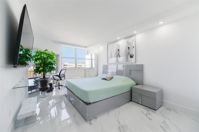 bedroom featuring recessed lighting, marble finish floor, and baseboards