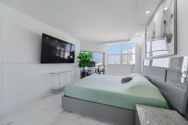 bedroom with marble finish floor and baseboards