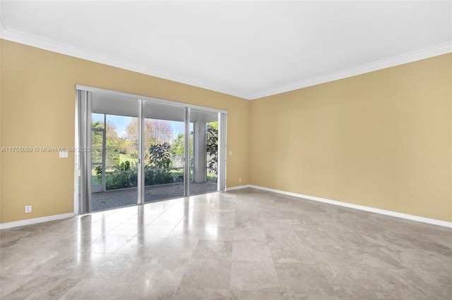 unfurnished room featuring crown molding and baseboards