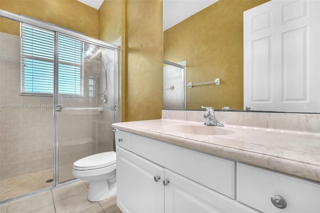 full bathroom featuring toilet, tile patterned flooring, vanity, and a shower stall