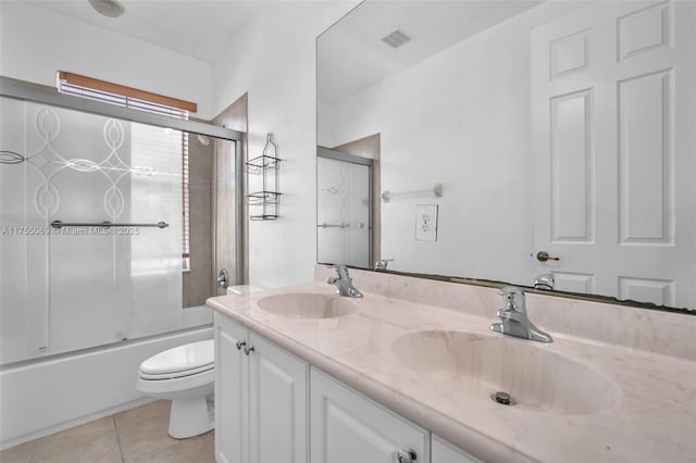 bathroom featuring visible vents, tile patterned flooring, a sink, and toilet