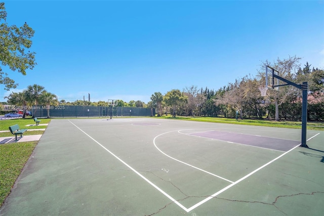 view of basketball court featuring community basketball court and fence