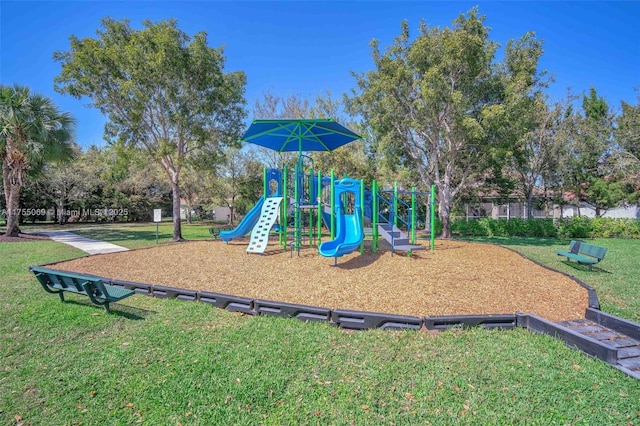 community jungle gym with a lawn