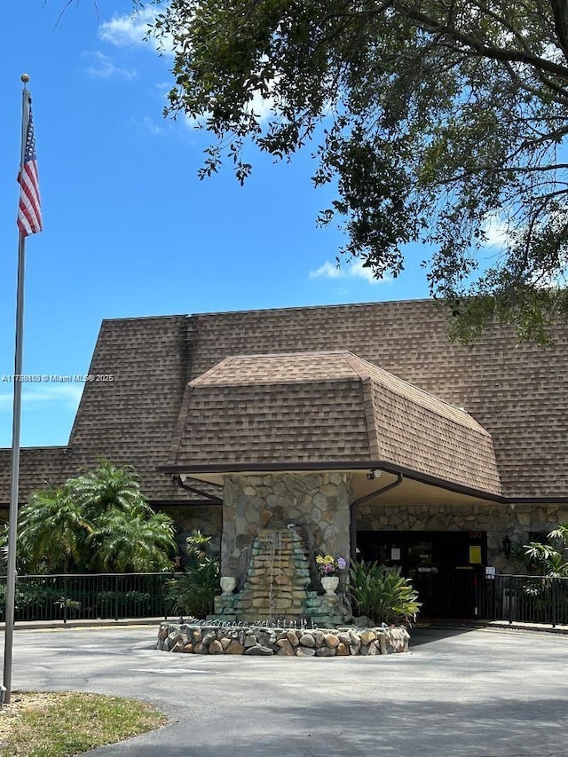 view of building exterior with driveway