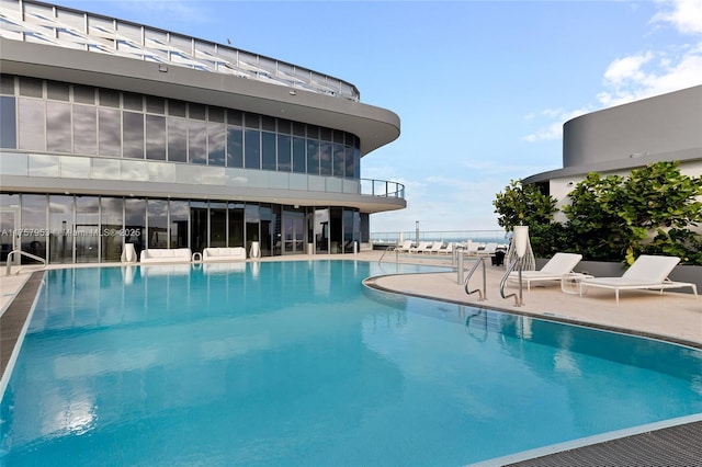 community pool featuring a patio area