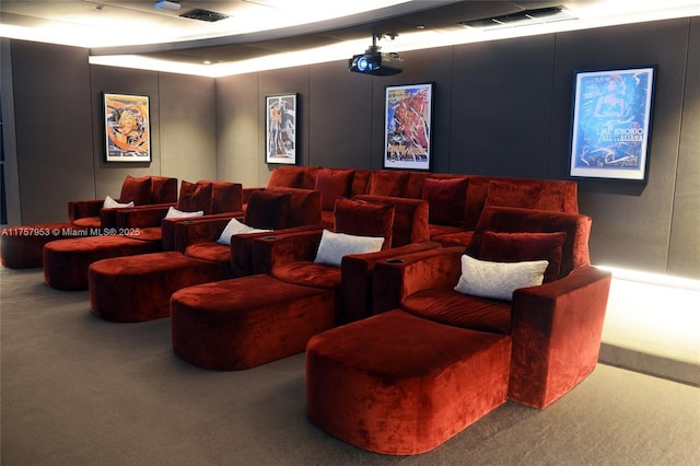 home theater room with carpet floors and visible vents