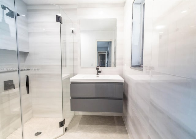 bathroom featuring a shower stall and vanity