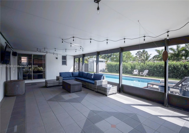 unfurnished sunroom with rail lighting