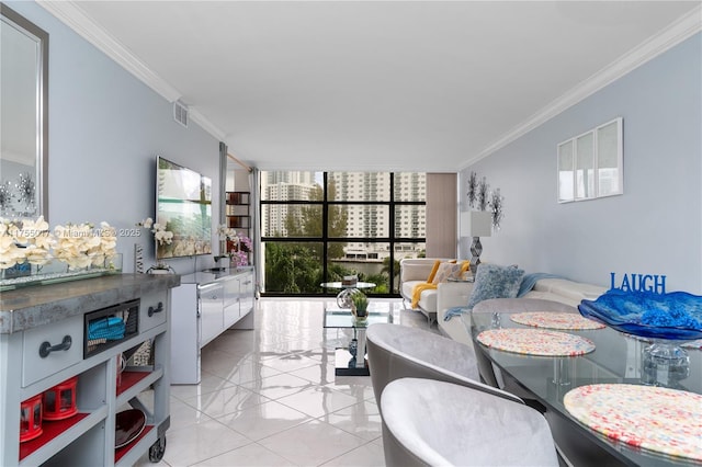 dining space with visible vents, crown molding, and a wall of windows