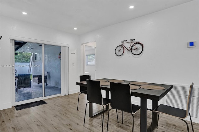 dining area with recessed lighting, baseboards, and wood finished floors