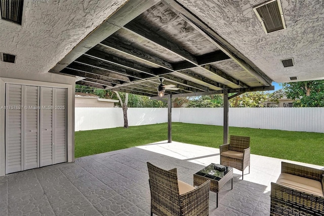 view of patio / terrace with ceiling fan, a fenced backyard, and visible vents