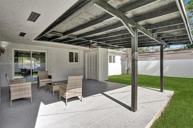 view of patio featuring fence