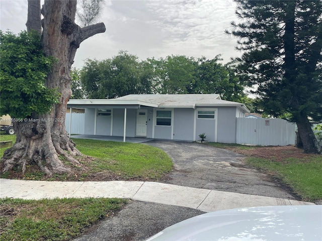 4161 SW 56th Ave, Davie, FL 33314 - view of front facade with driveway, a gate, and stucco siding