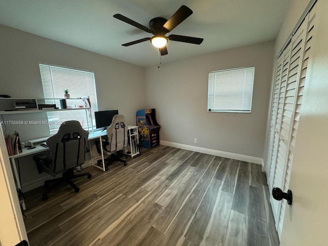 office space featuring ceiling fan, baseboards, and wood finished floors