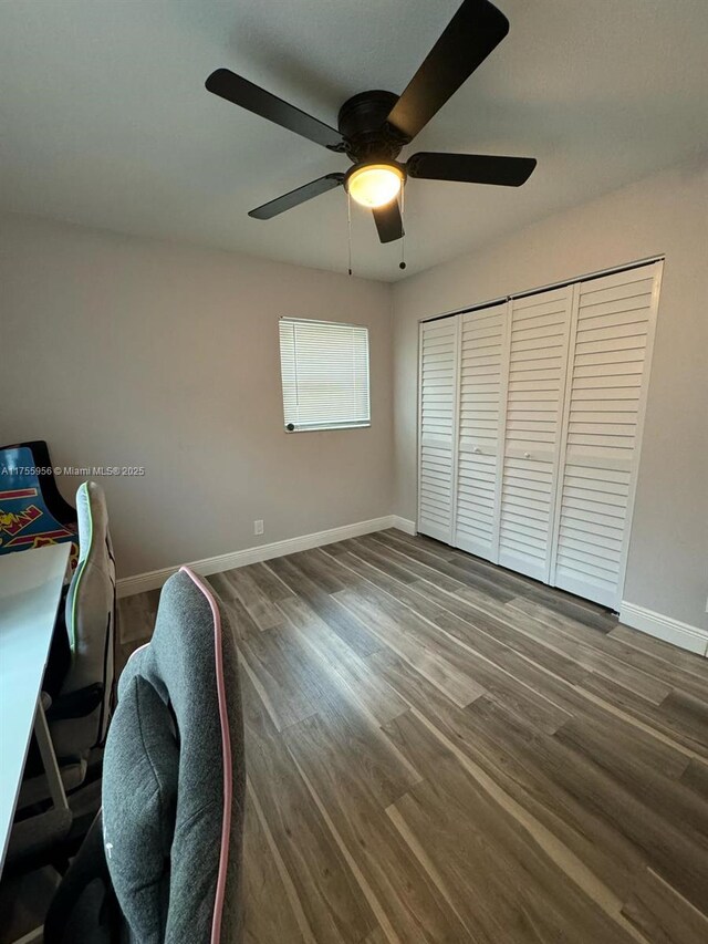 office area with baseboards and dark wood-style floors