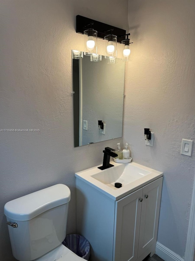4161 SW 56th Ave, Davie, FL 33314 - half bathroom with vanity, toilet, and a textured wall