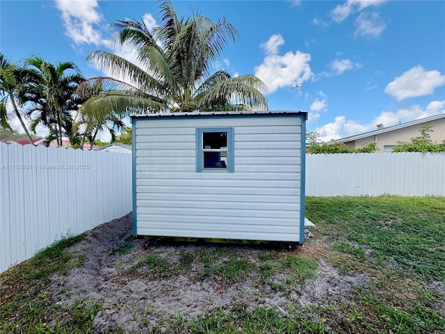 view of shed with a fenced backyard