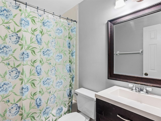 bathroom with toilet, shower / bath combination with curtain, and vanity