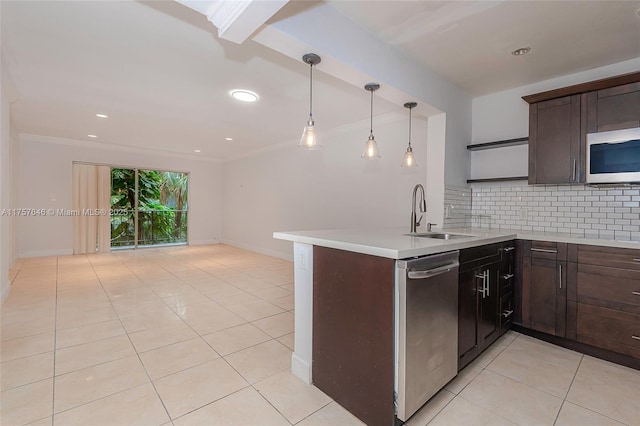 kitchen featuring backsplash, stainless steel appliances, dark brown cabinets, a sink, and light tile patterned flooring