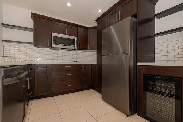 kitchen with dark brown cabinetry, wine cooler, appliances with stainless steel finishes, light countertops, and open shelves