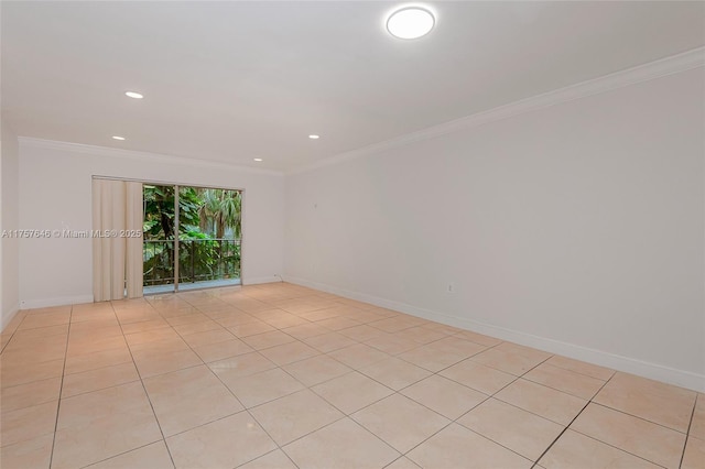 spare room featuring ornamental molding, recessed lighting, and baseboards