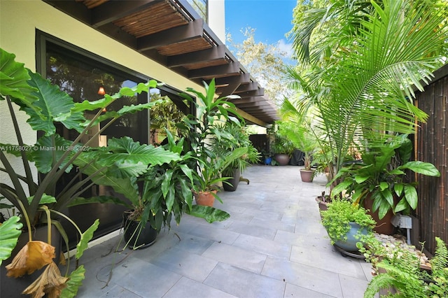 view of patio featuring fence