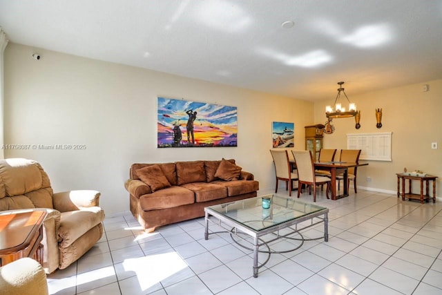 living room with light tile patterned floors and an inviting chandelier