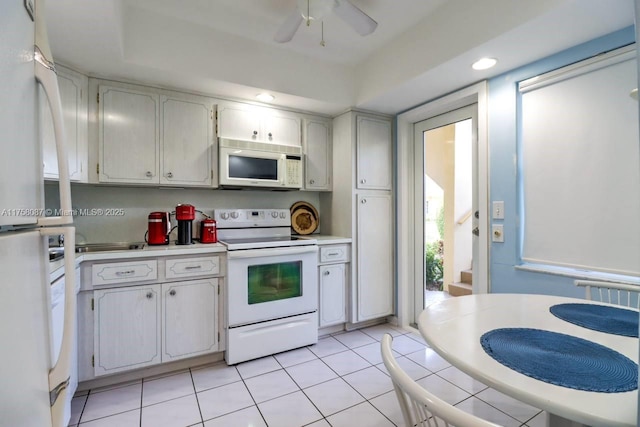 kitchen featuring white appliances, recessed lighting, a ceiling fan, light countertops, and light tile patterned flooring