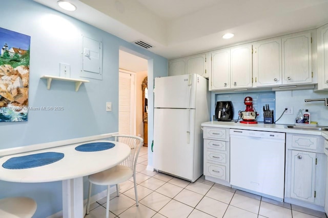 kitchen featuring light tile patterned floors, white appliances, visible vents, white cabinetry, and light countertops