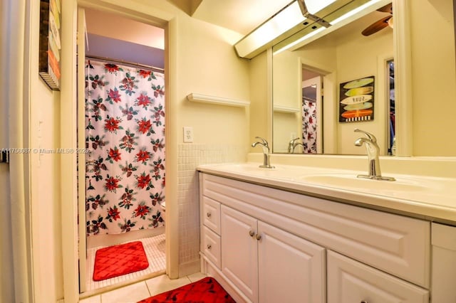 850 NE 12th Ave Unit 210, Hallandale Beach, FL 33009 - full bathroom featuring tile walls, double vanity, a sink, and tile patterned floors