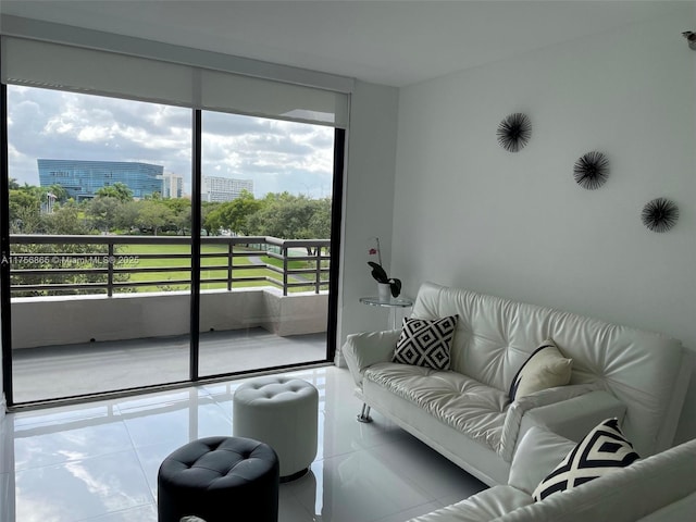 living area with a view of city and tile patterned flooring