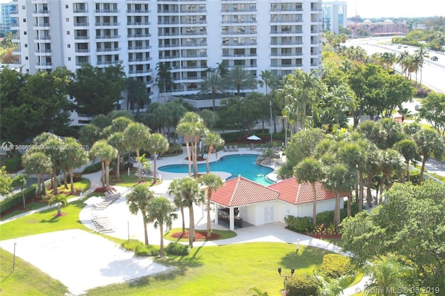 view of community featuring a yard and a patio