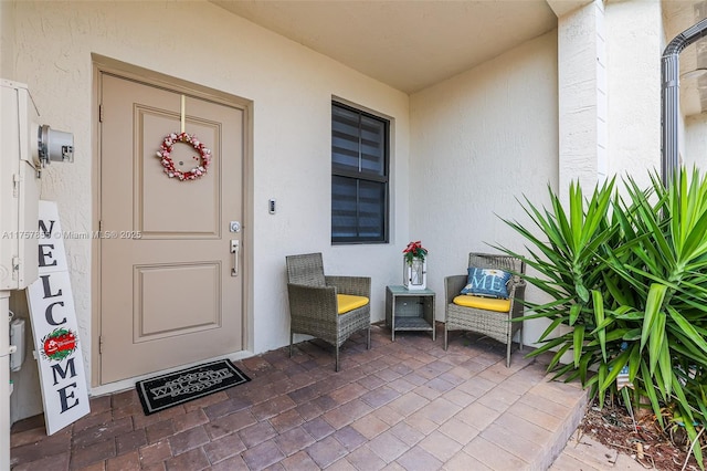 property entrance featuring stucco siding