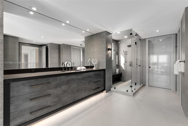 full bath featuring a stall shower, vanity, and recessed lighting