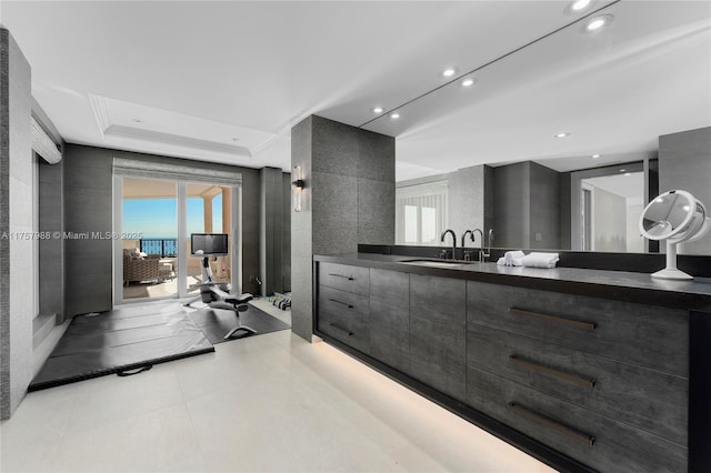 full bathroom with recessed lighting, a raised ceiling, and vanity