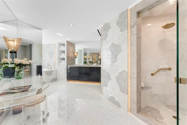 bathroom with marble finish floor, a garden tub, vanity, a shower stall, and recessed lighting