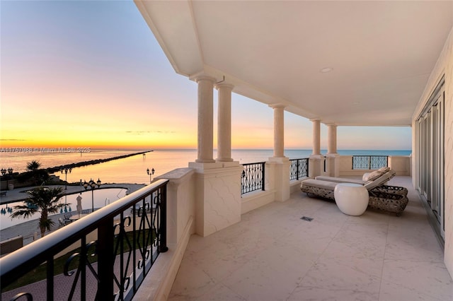 balcony featuring a water view