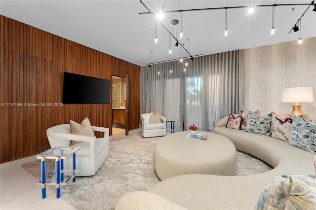 living room with wood walls